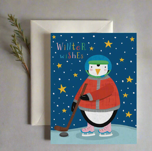 Greeting card with a penguin holding a hockey stick and 'Winter Wishes' text on a blue background.